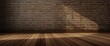 © TheWaterMeloonProjec - Blank wooden floor texture set before a weathered brick wall background with gentle lighting