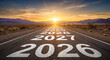 © Clipix - 2026 future journey concept with years painted on highway leading to desert sunset