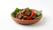 © Isolated Stock - Delicious authentic beef rendang, a spicy Indonesian and Malaysian dish, served with chilies, isolated on white background