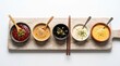© Its_RDP - A wooden board showcasing a variety of five different dipping sauces, including ketchup, peanut butter sauce, capers, mayonnaise, and a yellow sauce