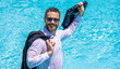 © be free - Business success. Businessman in suit in swimming pool. Excited businessman in wet suit in swim pool. Remote working. Business drink summer cocktail in suit in water pool. Summer travel