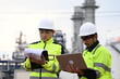 © Kanlaya - Industrial engineers inspecting operations at a petrochemical and energy plant. Professionals monitoring production systems, infrastructure, safety standards and industrial facility performance.