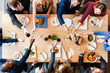 © Rawpixel.com - Diverse group dining together joyfully