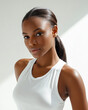 © halcon1 - Portrait of beautiful black woman in white top with ponytail hairstyle. Glowing healthy skin texture, look, beauty, skincare or fitness lifestyle concept