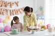 © New Africa - Birthday celebration. Mother and daughter preparing candy bar for festive party at home