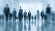 © Fazley - Motion blur of business people walking in a modern office lobby, corporate crowd commuting in high-speed rush hour