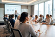 © Meow Creations - Business team listening to presentation in modern office