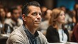 © KanStockPng - Professional Middle-Aged Man Attending Conference or Seminar in Audience