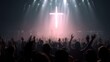 © Pichkan - Silhouette of crowd of believers raising hands in front of illuminated cross at religious event
