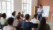 ©  TOFEL - Businessman giving presentation to students