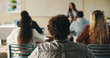 © peopleimages.com - Learning, teenager or students with teacher in classroom, education or listen for lesson understanding. Lecture, curriculum or people with educator for academic development, project info or knowledge