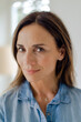 © Westend61 - Portrait of confident mature brunette woman