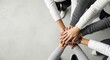 © Ariestia - Diverse Group of People Stacking Hands Together for Teamwork and Unity Concept with Copy Space