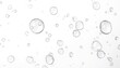 © lizba - A visually striking image of numerous transparent water bubbles of various sizes scattered across a pure white background