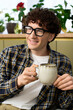 © Bliss - Enjoying a peaceful moment with coffee in a cozy modern apartment lifestyle