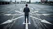 © gfxmukim - Rear view of a businessman standing in an empty asphalt parking lot facing multiple white arrow indicators pointing in different directions, symbolizing decision-making and career pathways.