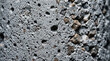 © Natalia - Concrete Texture Close-up: A detailed macro view of a concrete surface, showcasing its rough texture, aggregate inclusions, and subtle cracks, revealing the raw and industrial nature of the material.