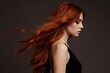 © Raisa - Young woman with vibrant long red hair styled in waves. She wears black dress with dark background. Her face shows subtle makeup and serene expression. This portrait emphasizes hair beauty and shine.
