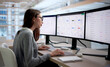 © Andrey Popov - Woman Finance Manager Using Software To Track Corporate Expenses