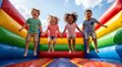 © Eka - Joyful childhood Kids jumping and laughing on a colorful inflatable bouncy castle
