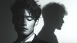 © Sangsung - Portrait of a Thoughtful Man with Artistic Shadow Reflection