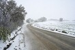 © Frauke Scholz/imageBROKER - Snowy country road with snow-covered trees and fields on a cold winter day, April, Pasayigit, Paşayiğit, Edirne Turkey