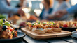 © Laura - Faceless friends enjoying appetizers and snacks at rooftop celebration, food element, culinary experience, social gathering, event catering, with copy space