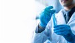 © Agni - closeup of lab technician holding test tube for analysis containing a precision sample representing advanced biotechnology research pharmaceutical machine working generative ai