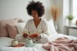 © YouraPechkin - Relaxed woman reads book in bed with drinks for quiet morning
