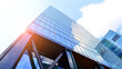 © Grand Warszawski - Steel and glass. The subject of modern architecture or construction industry. Modern office building facade with tall steel construction elements and full height windows between.