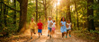 © Fandom - Group of happy diverse children running together along a sunlit forest path. Kids laughing and playing outdoors during a bright summer day. Healthy lifestyle and friendship concept for youth.
