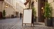© ip - A blank wooden sidewalk sign stands in a European city street, featuring a man in casual attire walking past in the background. Empty sign for cafe/restaurant in a historic European city center.
