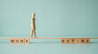 © mraual24 - Wooden mannequin walking on a narrow plank between the concepts of work and retirement life goals