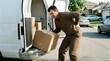 © Auraclicks - Occupational health concept showing a delivery man in brown workwear suffering from back strain while unloading a large package from a white delivery vehicle
