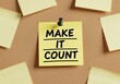 © Nandi - Yellow sticky note on corkboard with inspirational message make it count