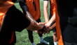 © Wosunan - Soccer players stacking hands together in a team huddle before a match, demonstrating unity