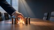 © wahyuni - Hand selecting glowing star from wooden figures on conference table