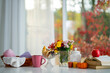 © Volodymyr - Autumn fall vibes with pastry and mulled wine. Cozy autumn decor. Fall atmosphere. Autumn vibes with books. Autumn home decor with flowers and candles.