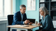 © RIOKO - Medical Consultation: Doctor Explaining Information To Patient On Tablet At Office