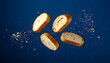 © Muji Creatives - Floating bread slices with crumbs against solid blue background