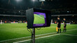 © Guram Ediberidze - Close-up of a VAR monitor on the sideline of an illuminated football stadium pitch