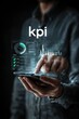 © Sapri - Man Interacting With Futuristic Digital Dashboard Displaying KPI Metrics.