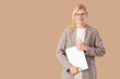 © Pixel-Shot - Young blonde businessman with laptop on beige background