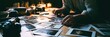 © Anat art - A photographer organizes printed photos on a wooden table. Warm light fills the room while film cameras are arranged around the scene
