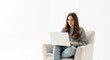 © Songpong - Young Woman Using Laptop On White Couch In Bright Modern Room