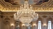 © Himam - Elegant chandelier in ornate room with architectural details and decorative ceiling