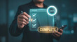 © ParinApril - Holographic Task Completion Interface Shows Checked Items and Progress Circle Above Professional's Hands to Verify Finished Tasks, Confirm Deliverables, Track Milestone Status