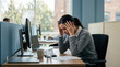 © IRWAN - Stressed Woman In Modern Office, Dealing With Pressure, Looking Overwhelmed at Work