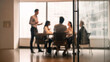 © Shanelle - Blurred Business People in Modern Office Conference Room Meeting, Seen Through Glass Partition