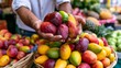 © CreativeArt - Market seller presenting a generous handful of colorful, sweet tropical mangoes, highlighting fresh produce and healthy choices available at local farmers' markets
